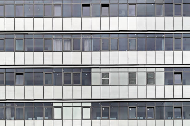 istock pattern from the windows of a multi-storey residential building 1356322674
