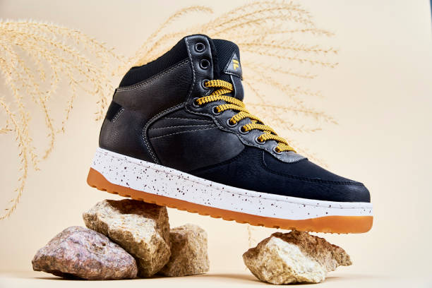 istock Male winter shoes on beige background 1356323219