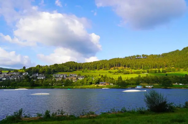 Hillestausee in the Sauerland with the surrounding nature. Landscape with a lake in the foreground.