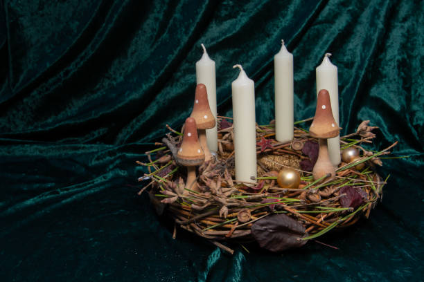 istock Self made Advent wreath with selective focus on foreground with four white candles, a tradition in the four weeks before Christmas, with copy space 1356324803