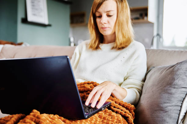 istock Woman working at home with laptop 1356324817