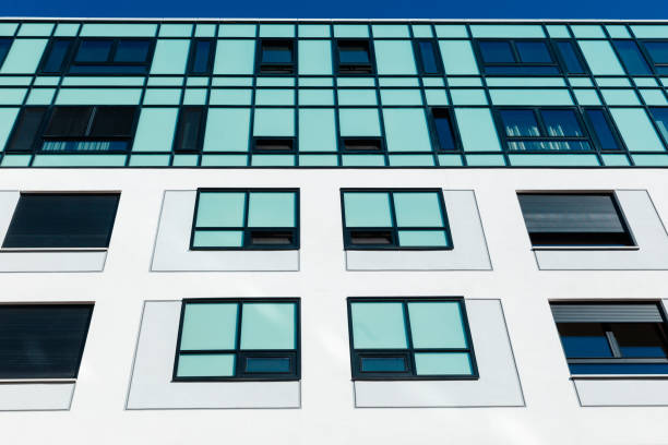 istock White concrete building exterior with turquoise colored windows 1356326359