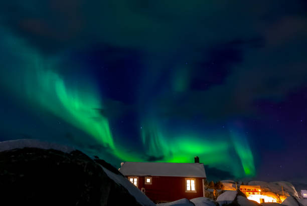 istock Aurora Borealis Over Norwegian Houses 1356326422