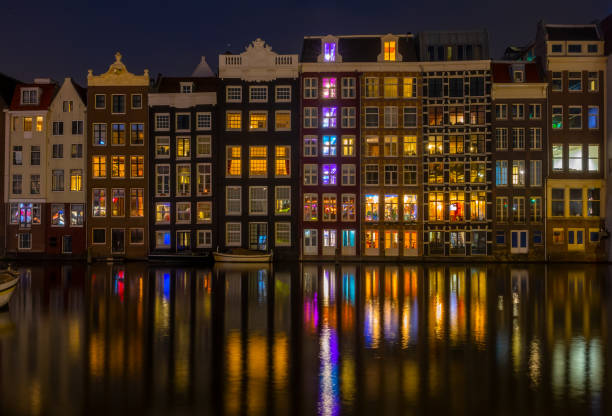 istock Dancing Houses on the Amsterdam Canal at Night 1356326425