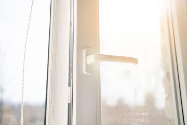 istock Modern white plastic pvc window with forest background at home, closeup view. Home interior 1356330894