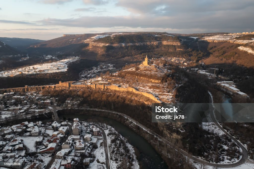 Landscape with the historical Tsarevets Hill Magnificent winter landscape with the historical Tsarevets Hill and the Patriarchal church in Veliko Tarnovo, Bulgaria Ancient Stock Photo