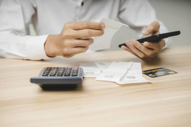 istock employee entering password code on mobile phone paying bill with credit card bill on desk in home office, internet, digital marketing, mobile banking, online payment and digital technology concept 1356335780