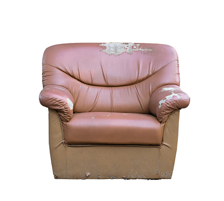 Old sofa leather broken and  missing isolated on white background with clipping path.