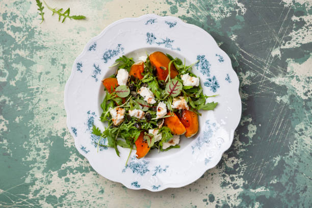 istock salad with roasted pumpkin, arugula and homemade cheese 1356337555
