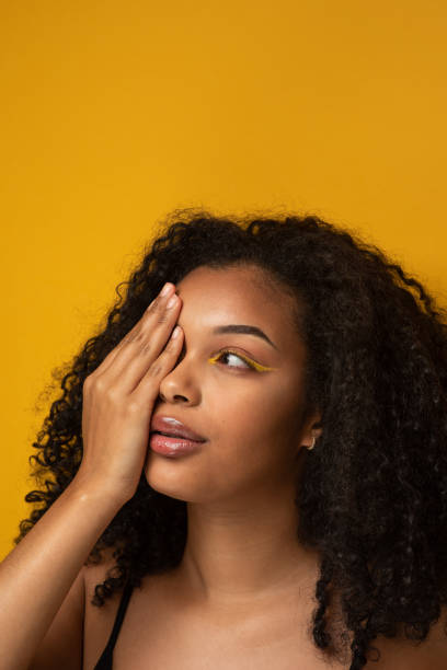 istock African woman with a  yellow eyeliner 1356337657