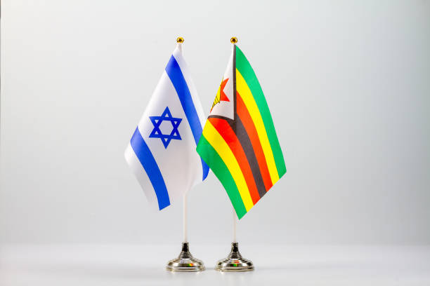 istock State flags of Israel and Zimbabwe on a light background. 1356340210