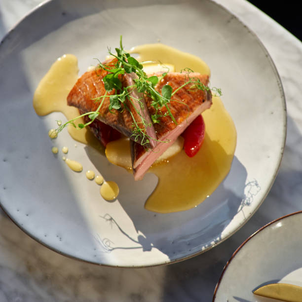 istock Duck breast with pears in orange-ginger sauce. 1356344212