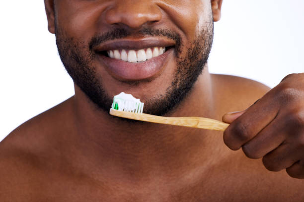 istock Studio shot of an unrecognizable young man brushing his teeth against a white background 1356344362