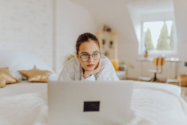 istock Happy young Woman in her Home Office and Using her Laptop 1356344589