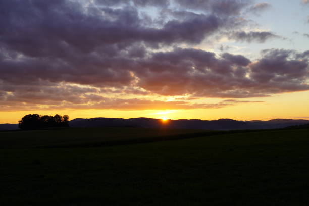 istock Sunset in the Sauerland. Landscape with setting sun in the evening. 1356345659