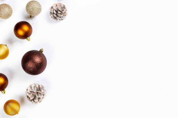 istock Christmas balls and pine cones on white background top view with copy space. Flat lay. Christmas and new year holiday background. Xmas greeting card concept 1356346683