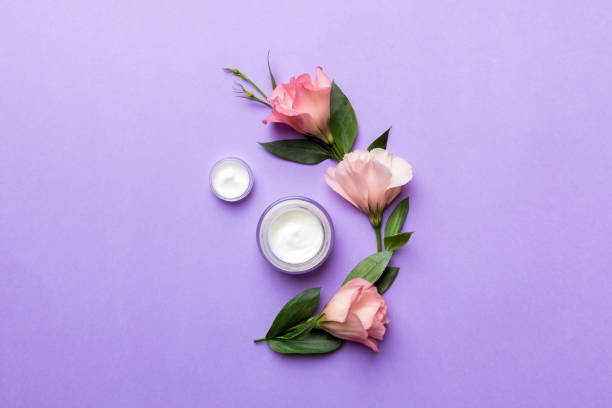 istock Composition with cosmetic products and beautiful roses on color background. Flat lay 1356350136