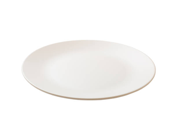 istock White ceramic round plate isolated over white background. perspective view 1356350221