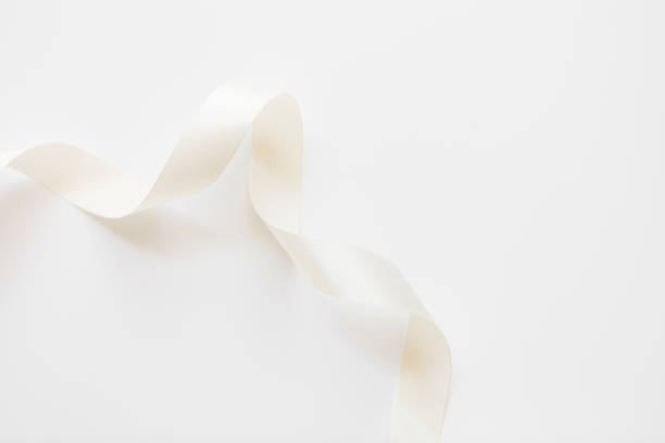 istock loops of white ribbon on gray text place - Image 1356352257