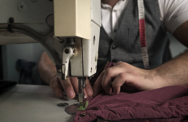 istock Man working at his tailor shop. 1356354069