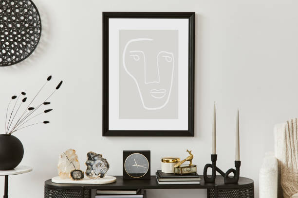 istock Creative living room interior composition with mock up poster frame, armchair, console and elegant personal accessories. Copy sapce. Template. 1356354314