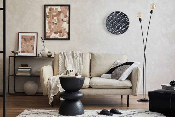 istock Modern composition of elegant living room interior design with mock up poster frame, sofa, console, coffee table and stylish personal accessories. Copy space. Template. 1356355341