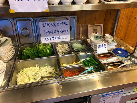 trolly full of vegetables in korean restaurant