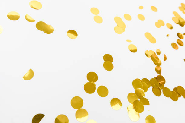 istock golden confetti on white background flat lay text place - Image 1356356240