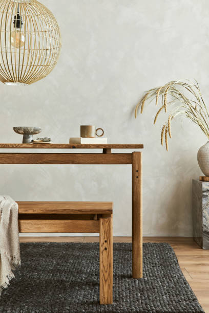istock Elegant dining room interior composition with wooden dining table, bench and design home decorations and personal accessories. Modern home staging. Wabi sabi inspiration. Template. 1356356311