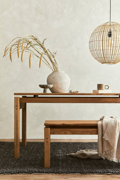 istock Elegant dining room interior composition with wooden dining table, bench and design home decorations and personal accessories. Modern home staging. Wabi sabi inspiration. Template. 1356356337