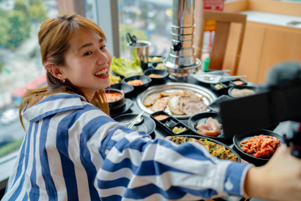 istock Vlogger is sharing food in famous restaurants. 1356356536