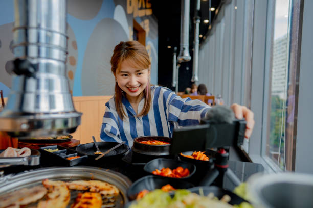 istock Vlogger is sharing food in famous restaurants. 1356356602