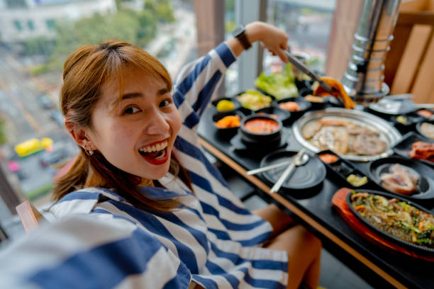 istock Vlogger is sharing food in famous restaurants. 1356356615