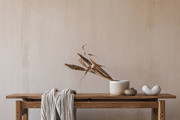 istock Elegant interior composition with elegant wooden bench. Beautiful decorations and accessories. Modern home interior design. Retro inspiration. Copy space. Structure wall. Template. 1356358798
