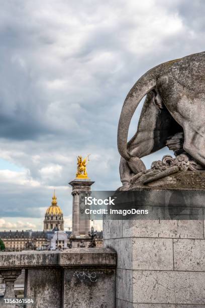 Tail Of A Lion Sculpture On Bridge Alexandre Iii View To The Military Museum Paris Stock Photo - Download Image Now