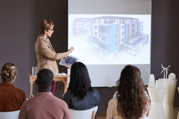 istock Man presenting the project of new building 1356361981