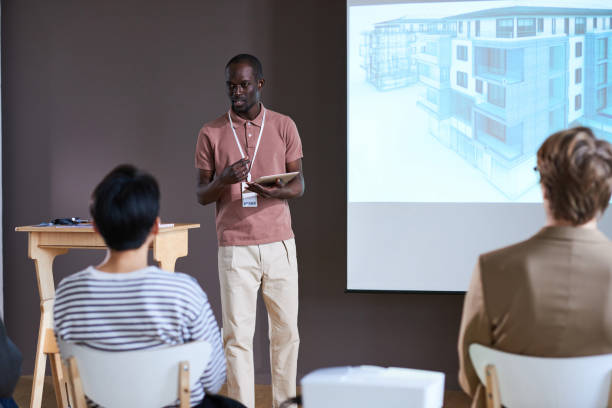 istock Businessman presenting his project to people 1356362156