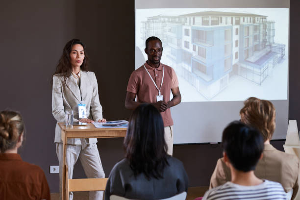 istock People talking about the new project of construction 1356362581