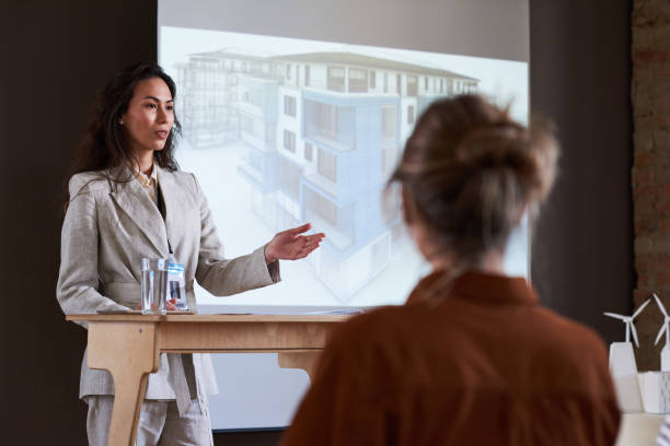 istock Architect presenting new project of building 1356362600