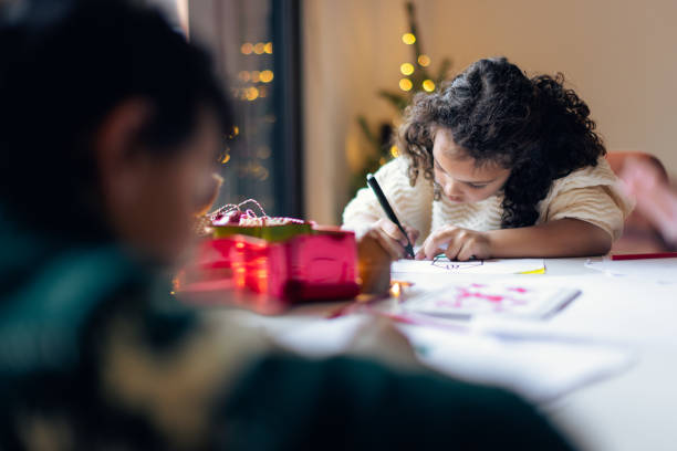 istock Siblings writing Christmas wish 1356362606
