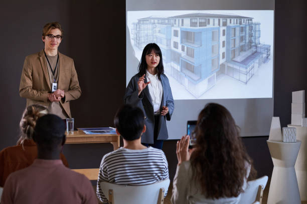 istock Business people presenting new building 1356362608