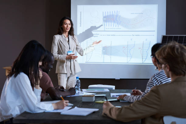 istock Business people sitting at seminar 1356363465