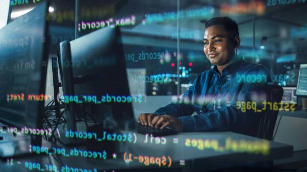 concept shot with visualisation of running computer code on foreground. portrait of handsome indian man in working on computer at night in office. digital entrepreneur creating modern software. - ��程式設計員 個照片及圖片檔