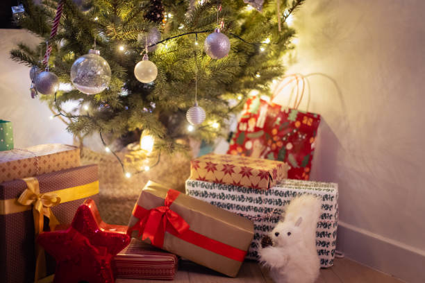 istock Christmas tree and a gifts 1356364825