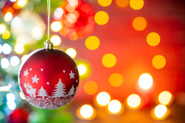 istock Christmas fir tree background with baubles, snowflake and glowin 1356365113