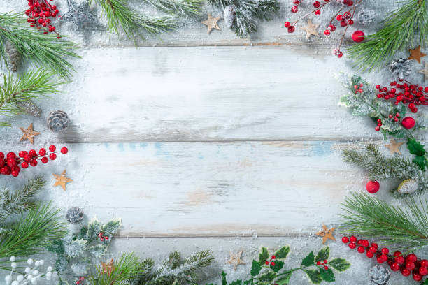 Christmas background frame with fir tree, holly, stars with snow Christmas background frame with fir tree, holly, stars with snow winter season christmas card photos stock pictures, royalty-free photos & images