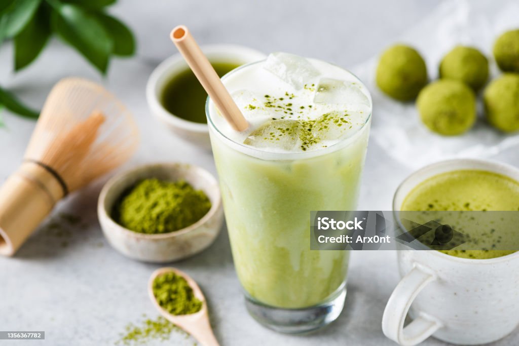 Delicious Vegan Matcha Ice Latte In Glass Delicious Vegan Matcha Ice Latte In Glass On Grey Stone Background Closeup View Matcha Tea Stock Photo