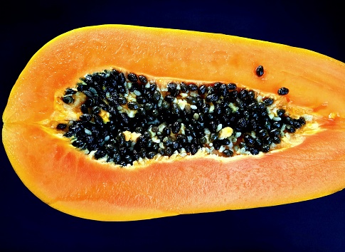 Closed up Papaya fruit and seeds.