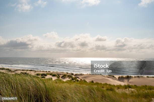 Summer In The Dunes With Clouds Drifting Over The Sea Stock Photo - Download Image Now