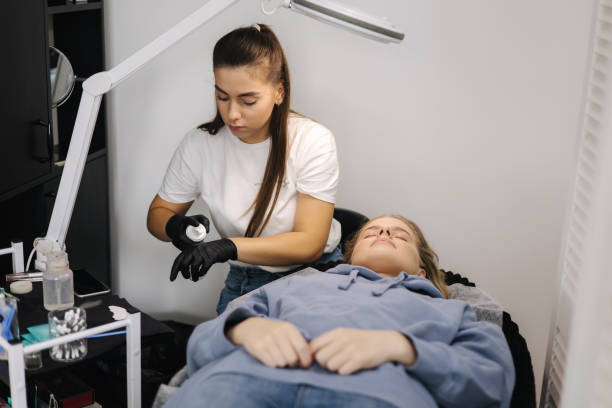 istock Young woman prparing for making eyelashes lamination in beauty studio 1356369234